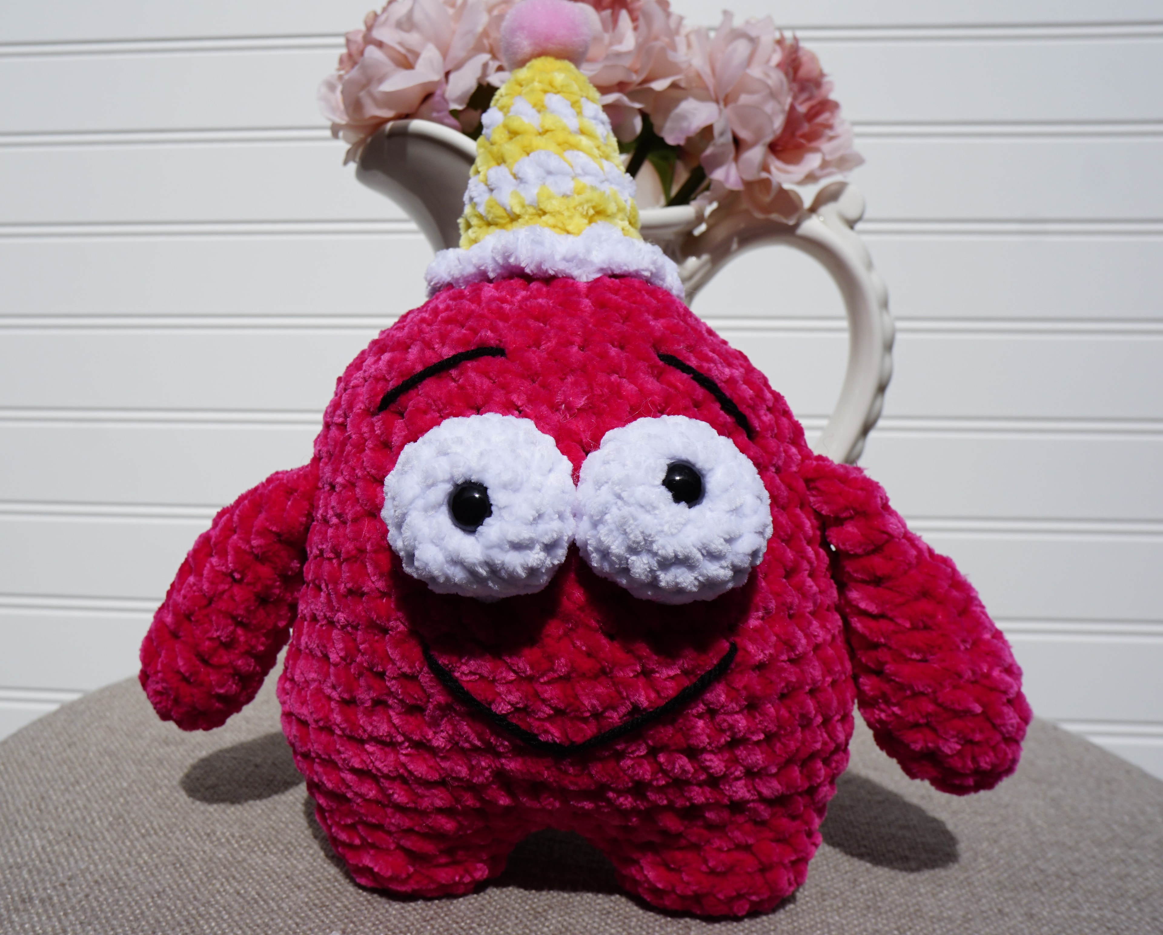 Handmade crocheted amigurumi red minion with birthday hat