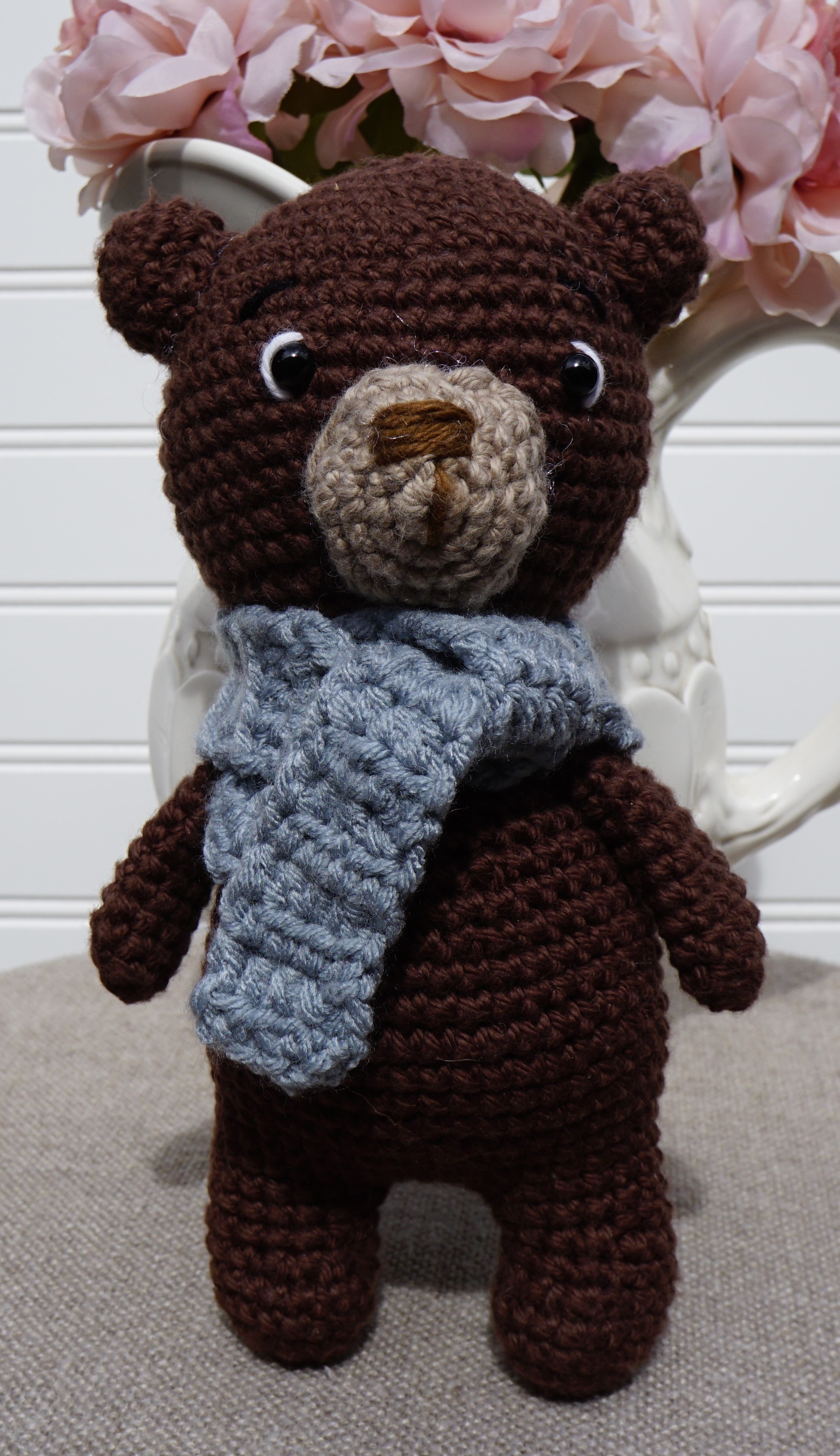Handmade crocheted amigurumi bear with scarf